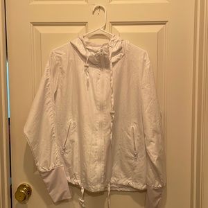 super cute zyia active jacket in white with a hood and thumb holes!